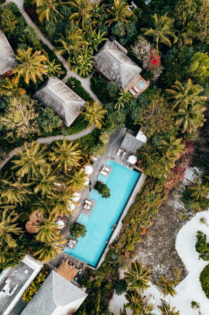 Aerial view of a luxurious resort with a pool in tropical Zanzibar.